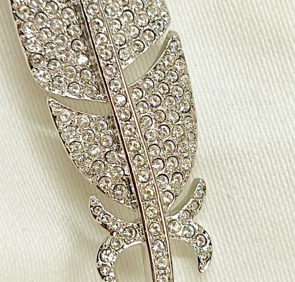 Classic signed Carolee rhinestone encrusted feather designer brooch.