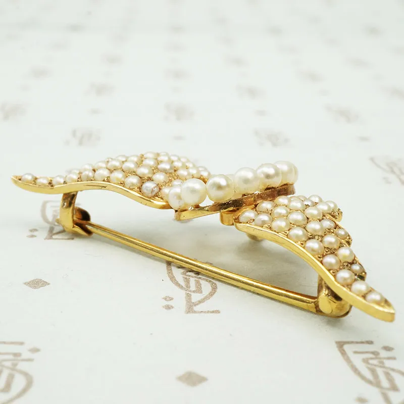 Gold Pearl Set Winged Wheel Brooch